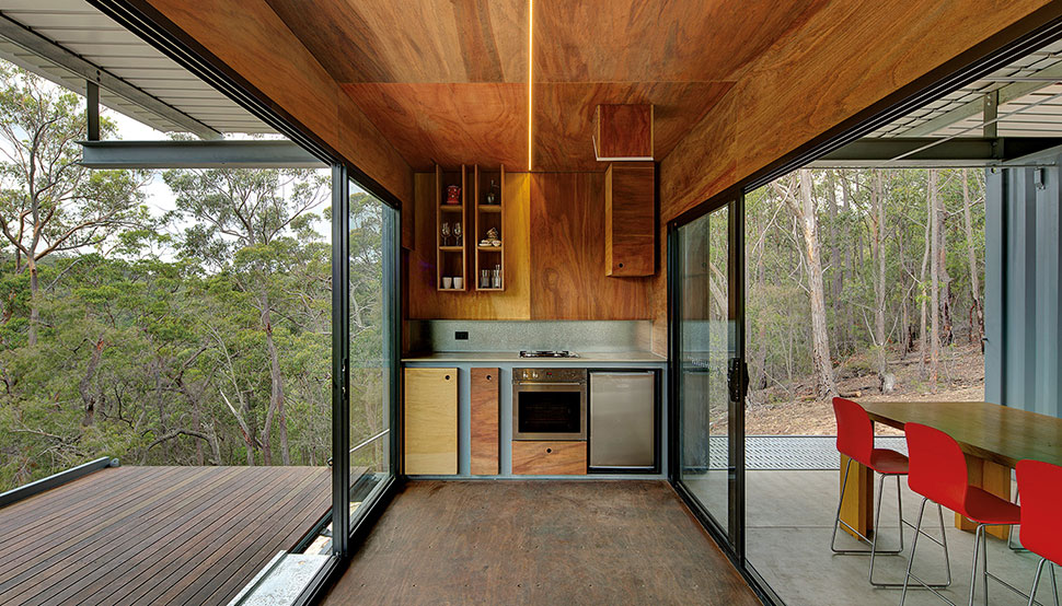 This bush retreat combines the brutal posturing of prosaic shipping containers with the refined elegance of a soaring lightweight roof made from COLORBOND® steel in LYSAGHT KLIP-LOK® 700 profile, in the colour Ironstone®