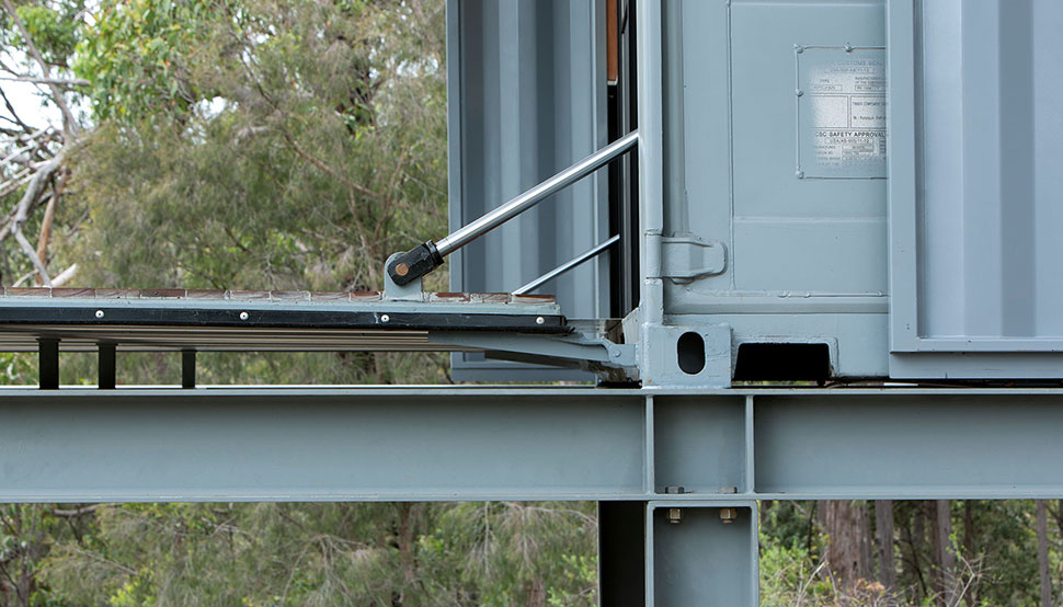 This bush retreat combines the brutal posturing of prosaic shipping containers with the refined elegance of a soaring lightweight roof made from COLORBOND® steel in LYSAGHT KLIP-LOK® 700 profile, in the colour Ironstone®