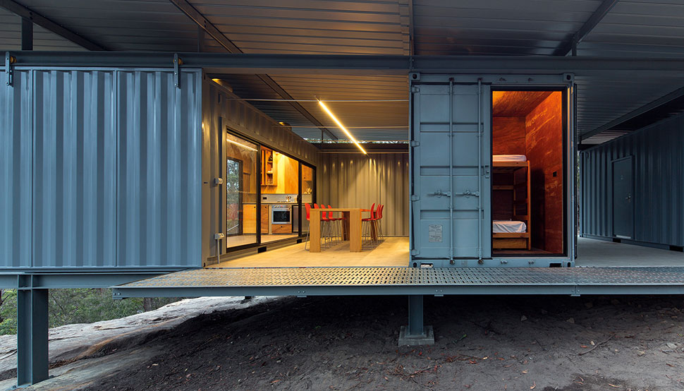 This bush retreat combines the brutal posturing of prosaic shipping containers with the refined elegance of a soaring lightweight roof made from COLORBOND® steel in LYSAGHT KLIP-LOK® 700 profile, in the colour Ironstone®