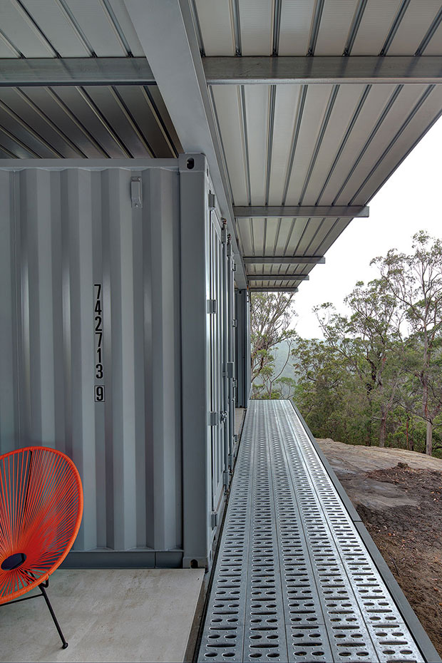 This bush retreat combines the brutal posturing of prosaic shipping containers with the refined elegance of a soaring lightweight roof made from COLORBOND® steel in LYSAGHT KLIP-LOK® 700 profile, in the colour Ironstone®