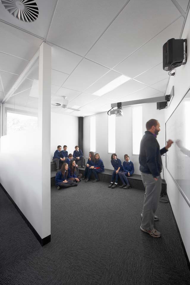 Dandenong High School is clad in Stramit Longspan® made from COLORBOND® steel in the lighter Shale Grey™ facing the sun, while the darker Night Sky® faces the shade.