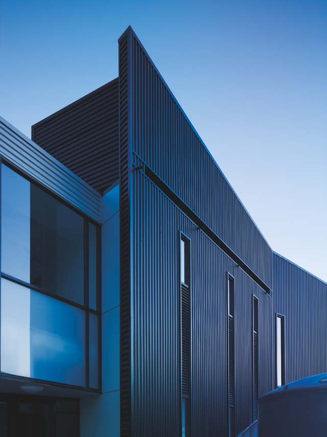 Dandenong High School is clad in Stramit Longspan® made from COLORBOND® steel in the lighter Shale Grey™ facing the sun, while the darker Night Sky® faces the shade.