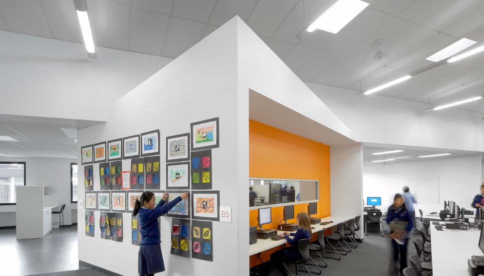 Dandenong High School is clad in Stramit Longspan® made from COLORBOND® steel in the lighter Shale Grey™ facing the sun, while the darker Night Sky® faces the shade.