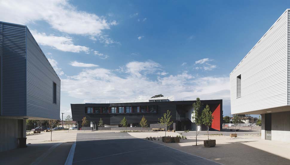 Dandenong High School is clad in Stramit Longspan® made from COLORBOND® steel in the lighter Shale Grey™ facing the sun, while the darker Night Sky® faces the shade.