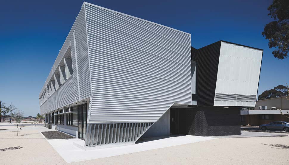 Dandenong High School is clad in Stramit Longspan® made from COLORBOND® steel in the lighter Shale Grey™ facing the sun, while the darker Night Sky® faces the shade.