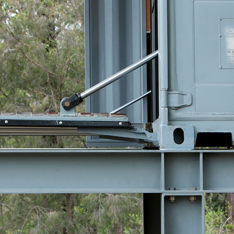 This bush retreat combines the brutal posturing of prosaic shipping containers with the refined elegance of a soaring lightweight roof made from COLORBOND® steel in LYSAGHT KLIP-LOK® 700 profile, in the colour Ironstone®