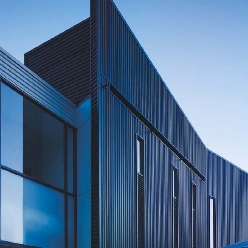 Dandenong High School is clad in Stramit Longspan® made from COLORBOND® steel in the lighter Shale Grey™ facing the sun, while the darker Night Sky® faces the shade.