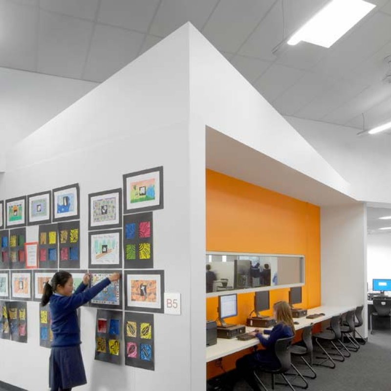 Dandenong High School is clad in Stramit Longspan® made from COLORBOND® steel in the lighter Shale Grey™ facing the sun, while the darker Night Sky® faces the shade.