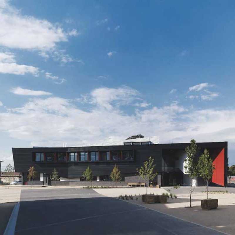 Dandenong High School is clad in Stramit Longspan® made from COLORBOND® steel in the lighter Shale Grey™ facing the sun, while the darker Night Sky® faces the shade.